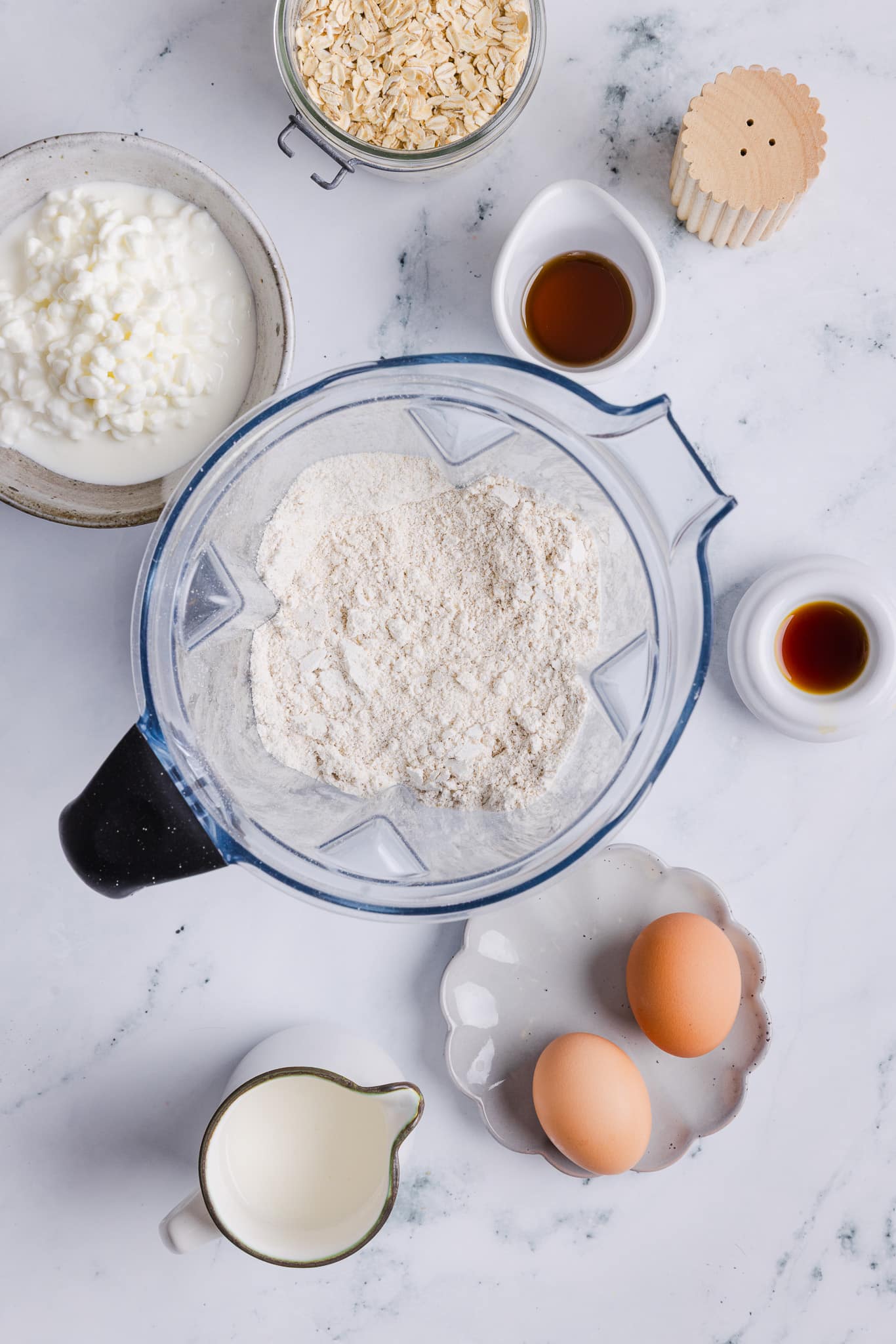Blended oats in a blender for oatmeal cottage cheese pancakes.