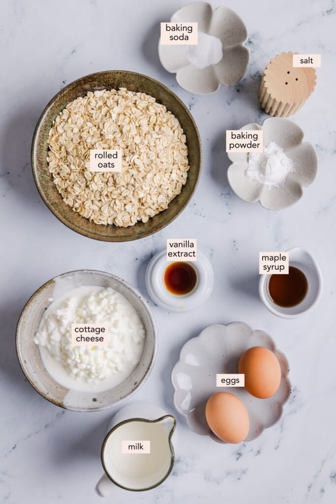 Oatmeal cottage cheese pancakes ingredients on a countertop with labels.