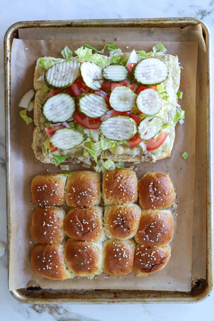 Slider rolls with ground turkey and toppings.