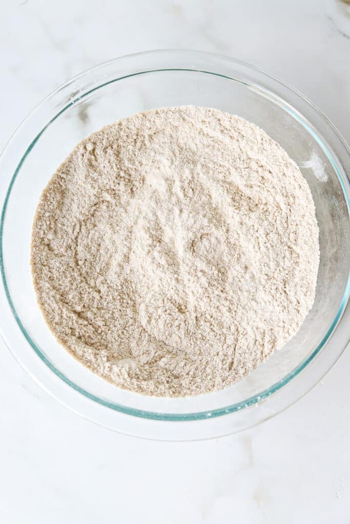 Mixed dry ingredients for kodiak banana bread in a bowl.