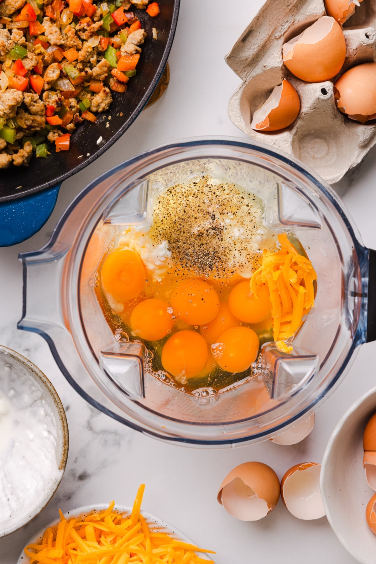 The eggs, seasonings, and cottage cheese in the blender before blending.