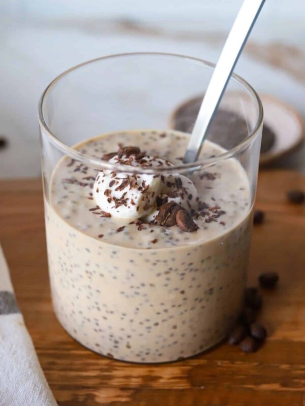 Coffee chia protein pudding in a glass container.