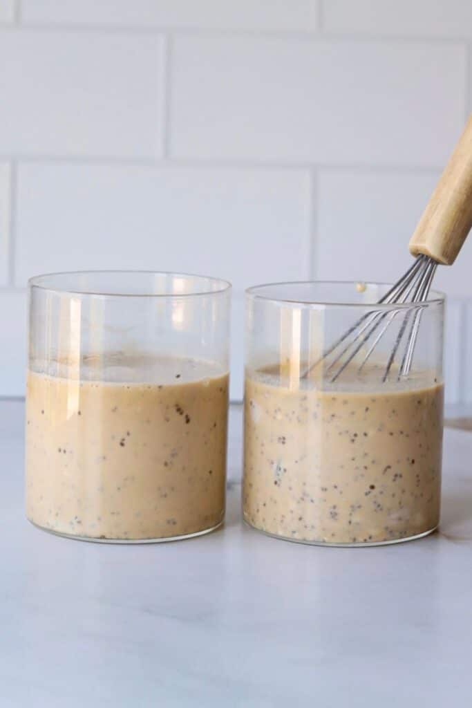 Coffee chia protein pudding ingredients in two containers mixed.