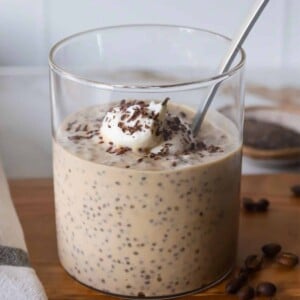 Coffee chia protein pudding in a glass container.