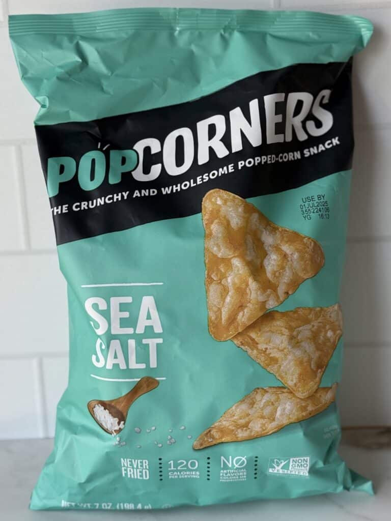 A bag of Popcorners chips on a countertop.