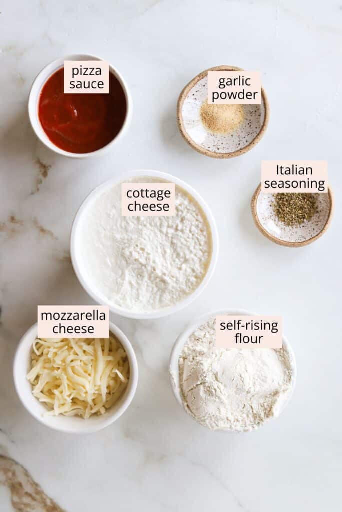 Ingredients for cottage cheese pizza crust with labels in bowls.