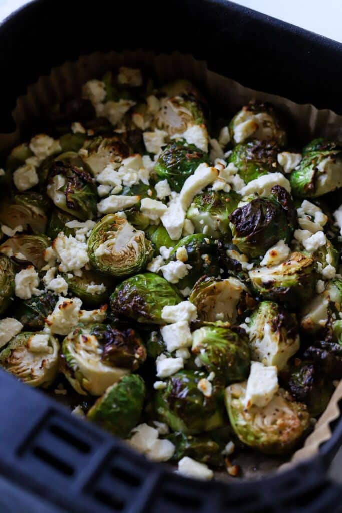A close up shot of air fried feta brussel sprouts.