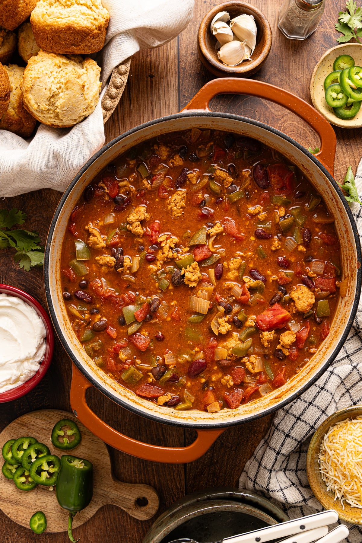 The cooked chili in a dutch oven on a countertop.