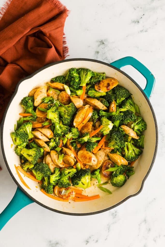 Chicken sausage broccoli stir-fry finished in a pan.