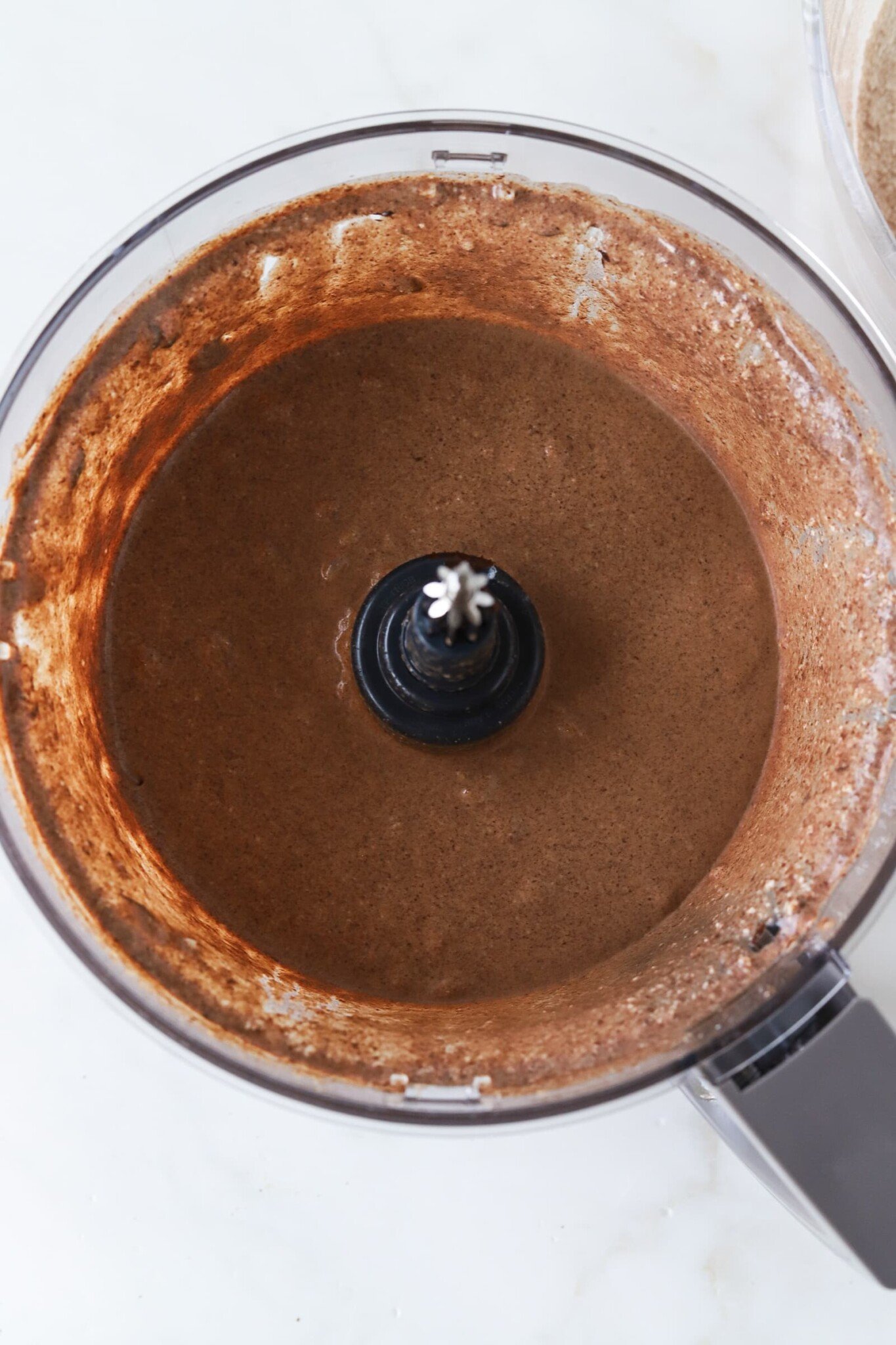 Ingredients for cottage cheese brownies blended in a food processor.