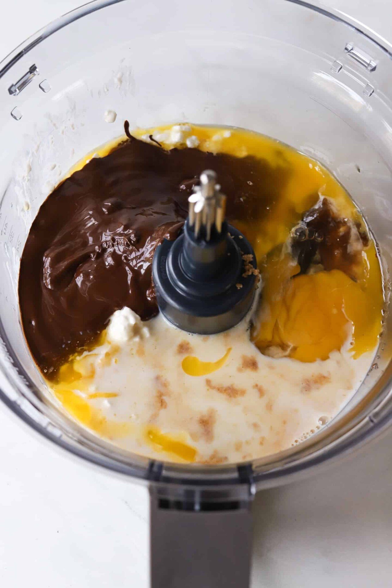 Ingredients for cottage cheese brownies in a food processor.