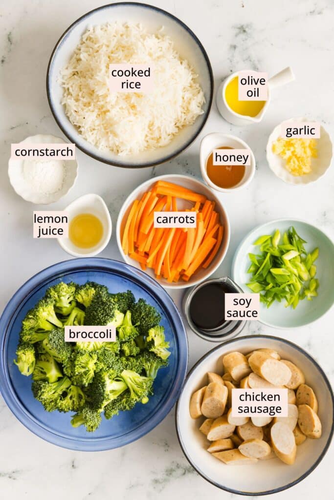Ingredients for sausage broccoli stir fry on a countertop with labels.