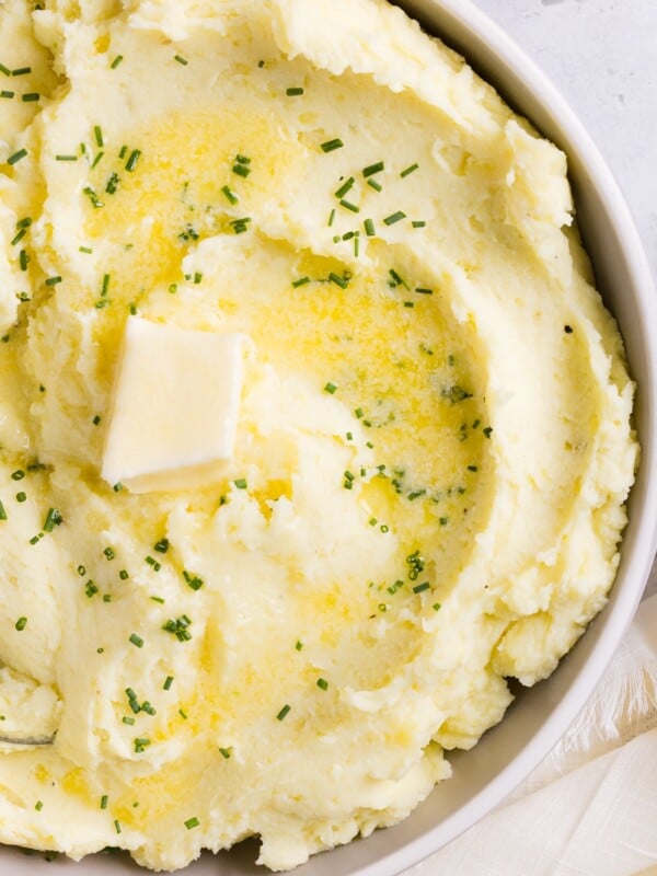 Ricotta mashed potatoes topped with butter and chives.