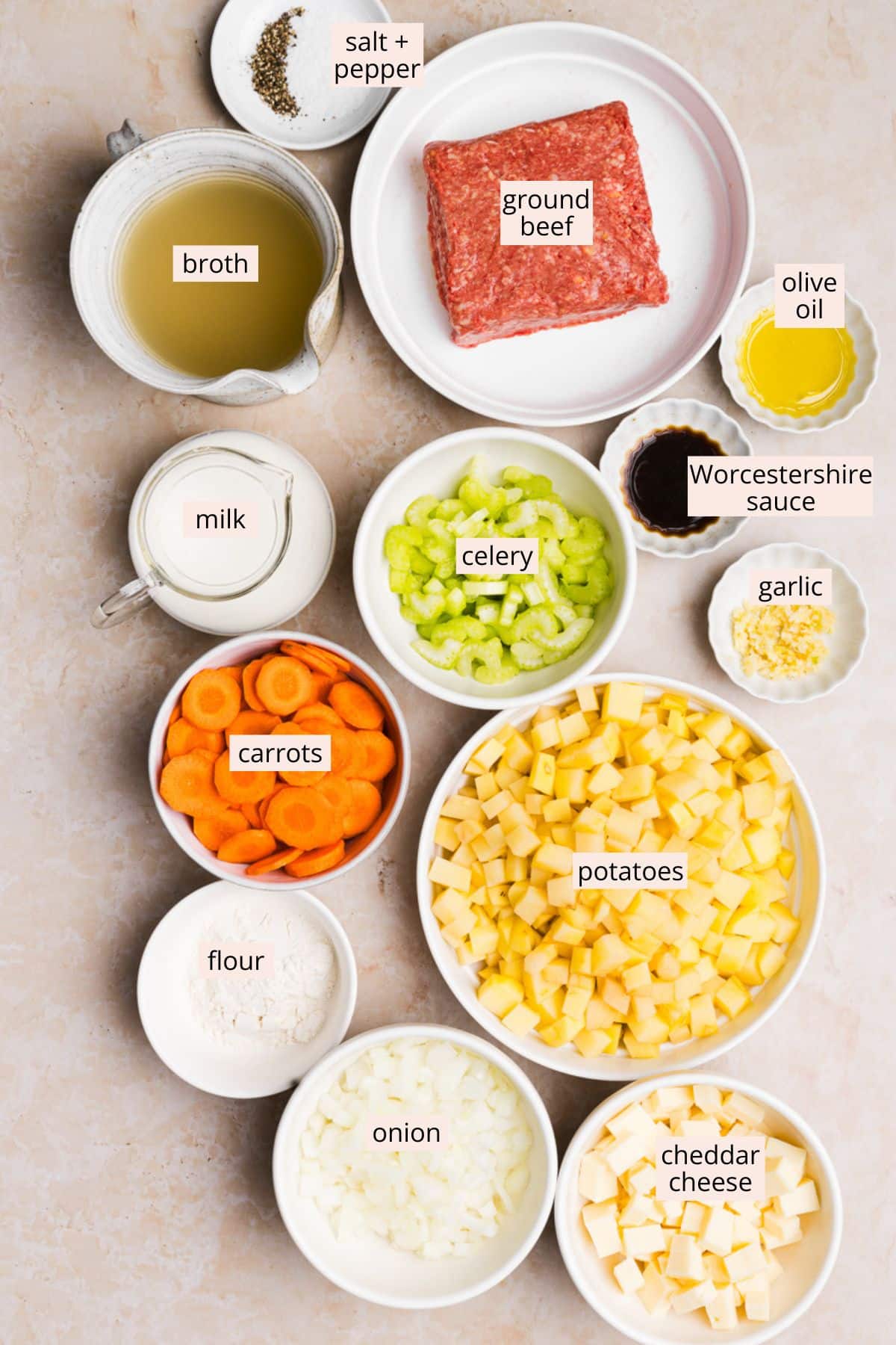 Ingredients for creamy. hamburger potato soup on a countertop with labels.