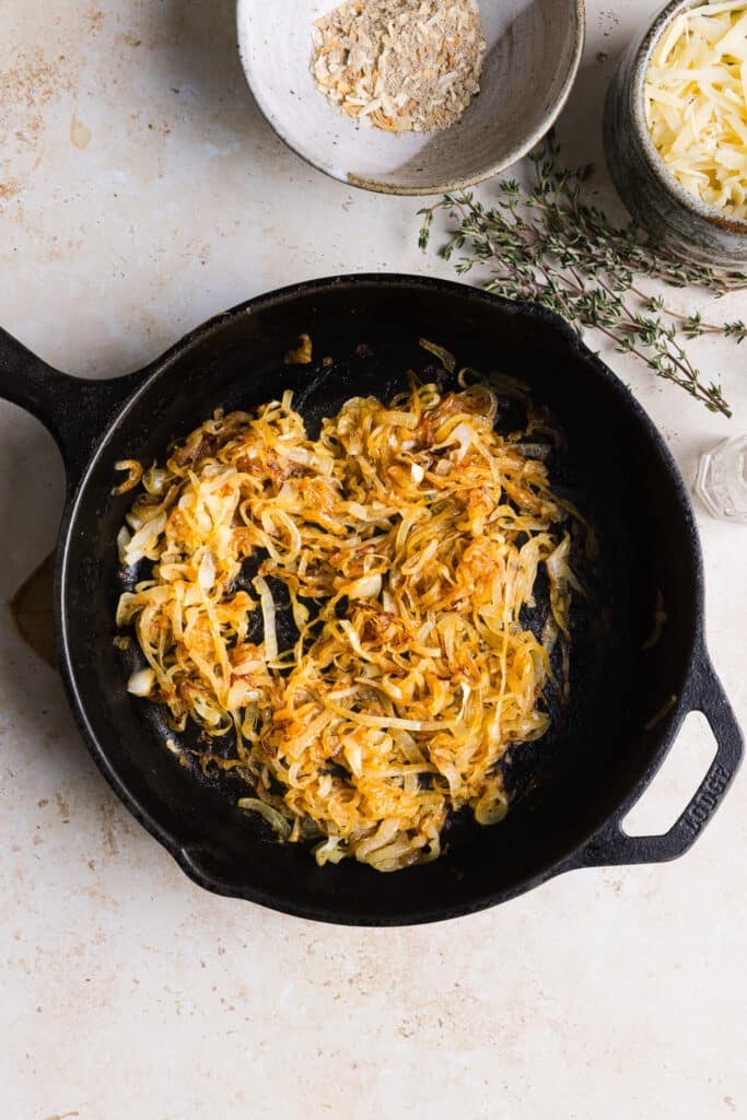Caramelized onions in a frying pan.