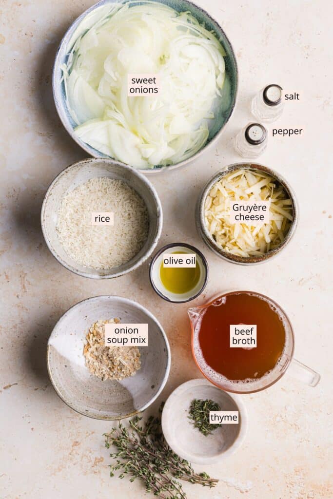 French onion soup rice ingredients in bowls with labels on a countertop.