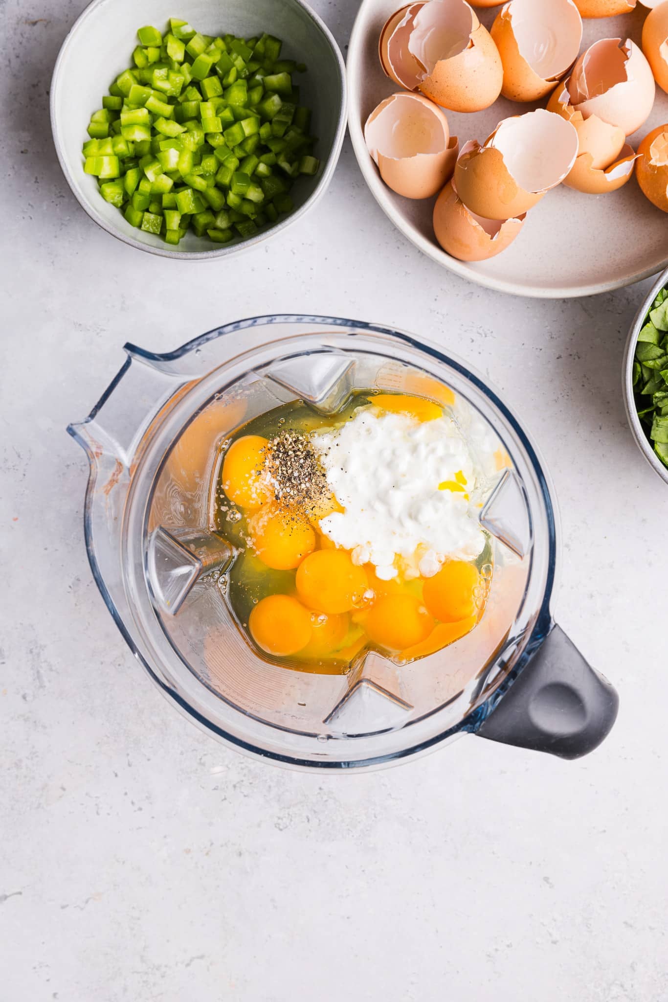 Ingredients for sheet pan eggs in a food processor.