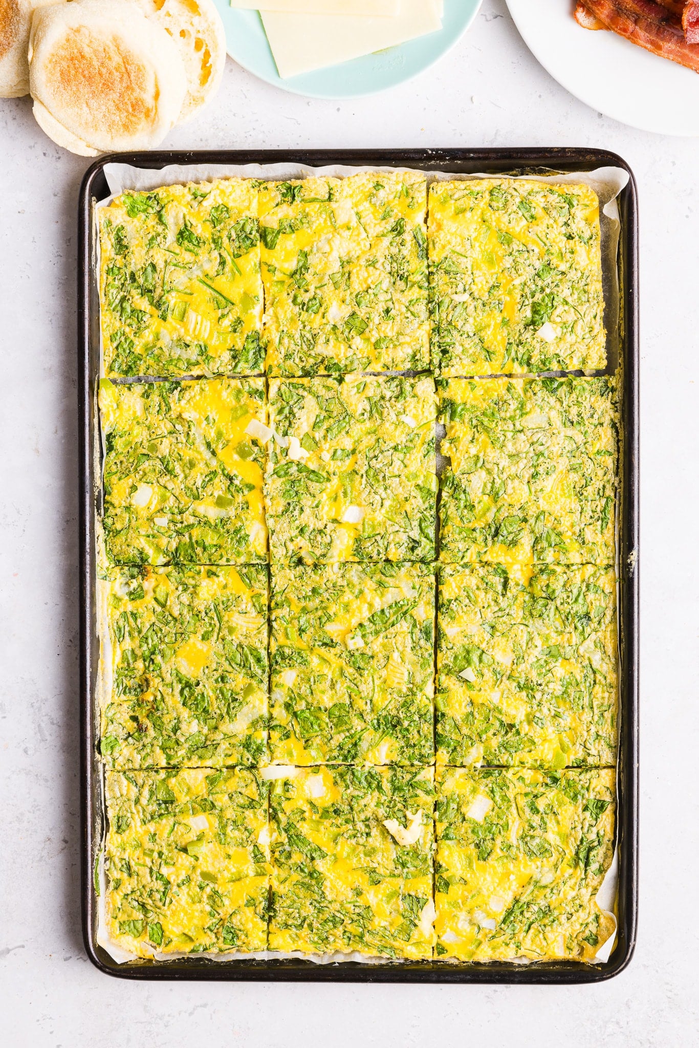 Sheet pan eggs sliced into 12 even slices.
