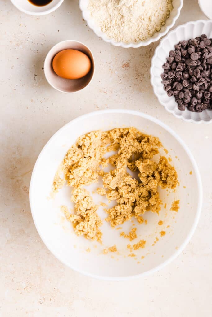 Brown sugar and butter creamed in a bowl.
