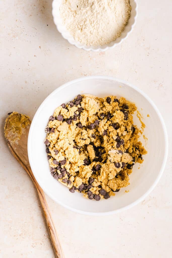 Chocolate chip whole wheat cookie dough in a bowl.