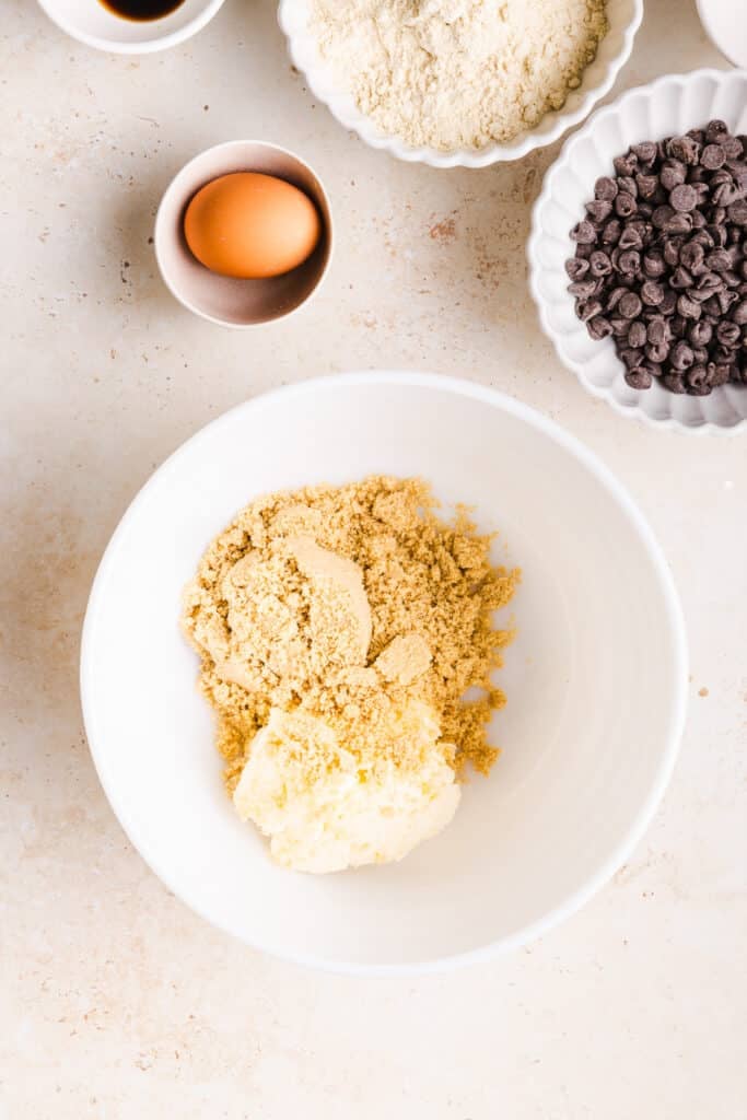 Brown sugar and butter in a white bowl.