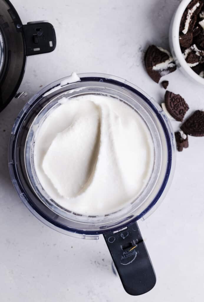 Ninja Creami Oreo milkshake in the pint container and base.