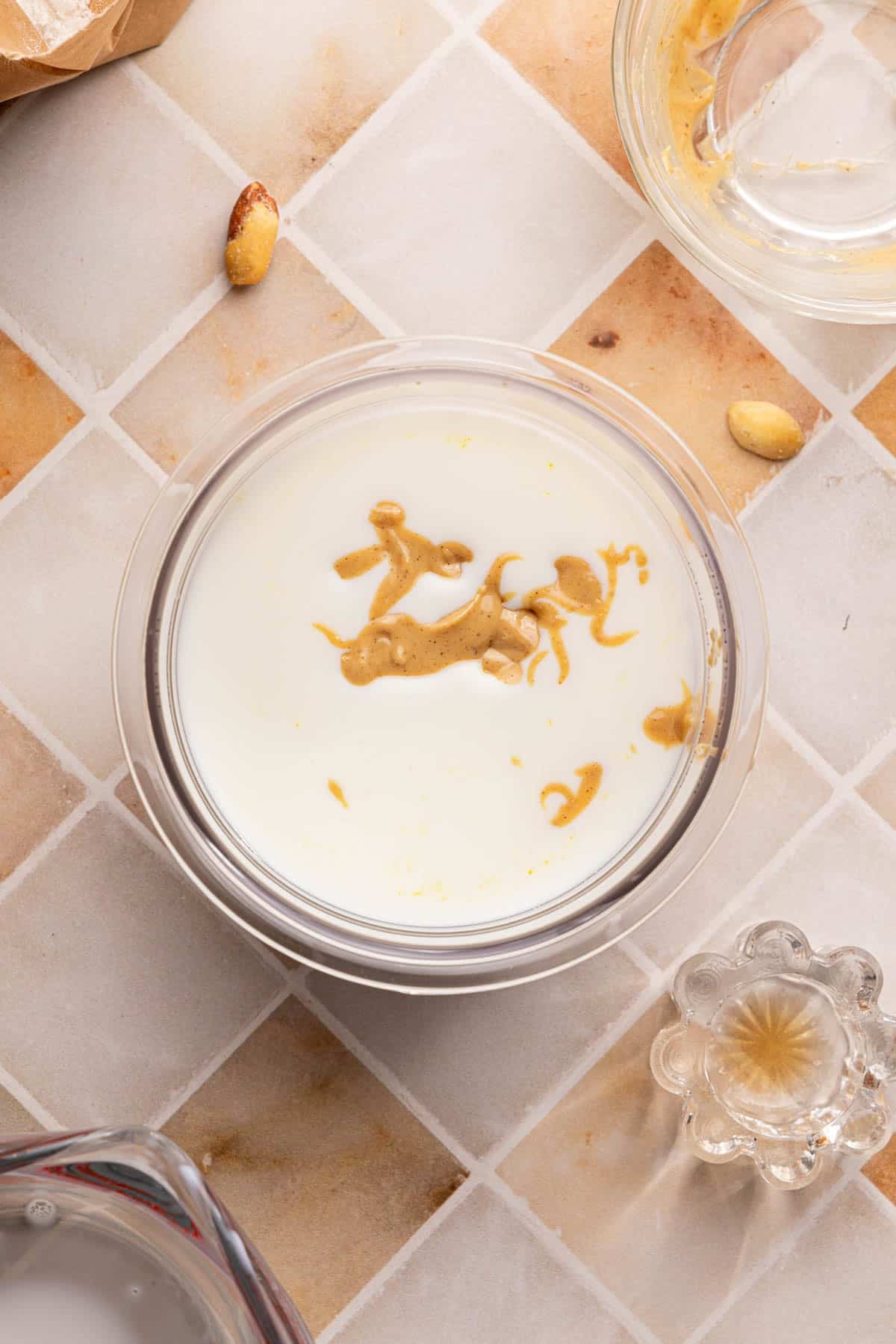 All of the ingredients for ninja creami peanut butter ice cream in the ninja creami container before mixing.