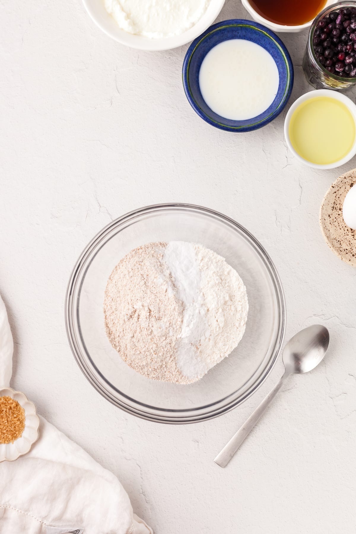 Dry ingredients for blueberry yogurt muffins in a bowl.