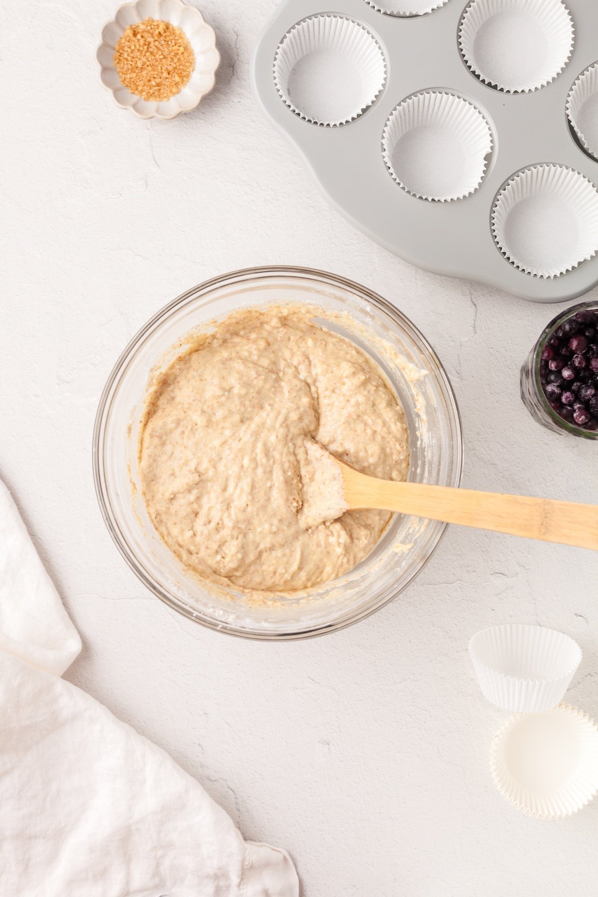 Blueberry yogurt muffin batter in a glass bowl.