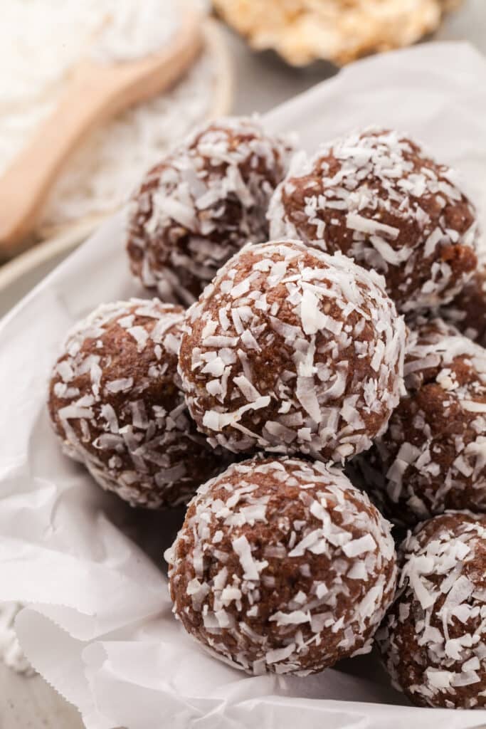 Coconut protein balls on a plate.