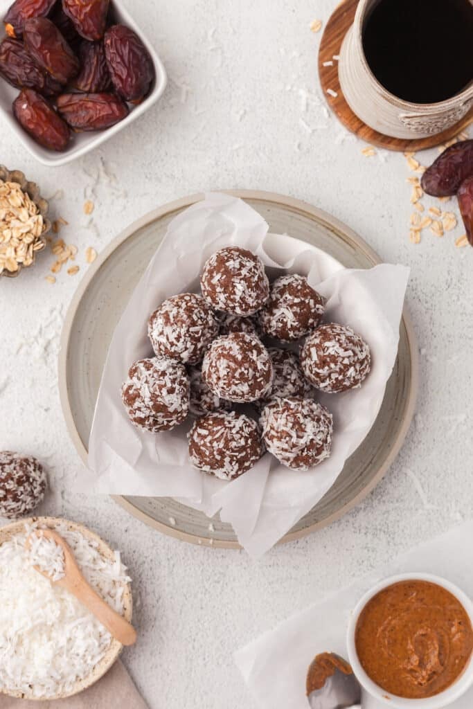 Coconut protein balls on a plate.