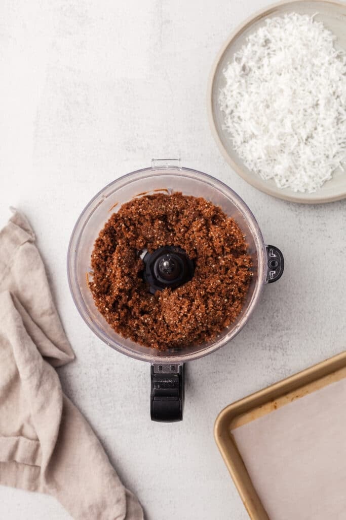 Coconut protein ball ingredients after being blended in a food processor.