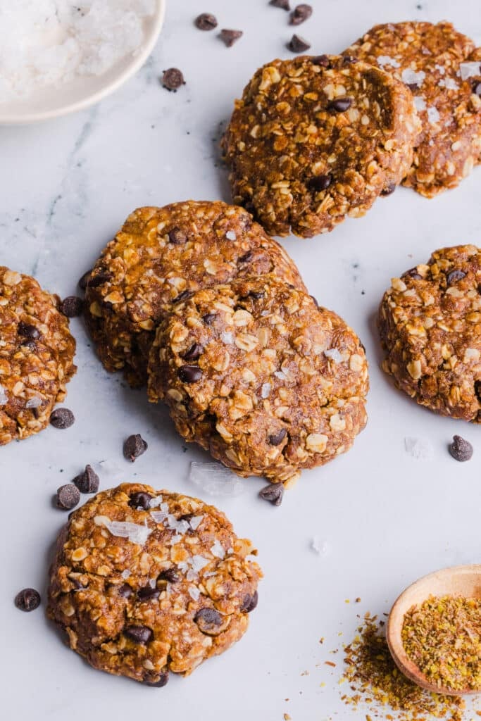 No bake protein cookies scattered on a countertop.