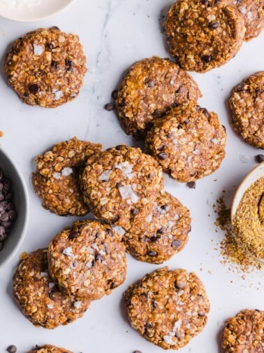 No bake protein cookies scattered on a countertop.