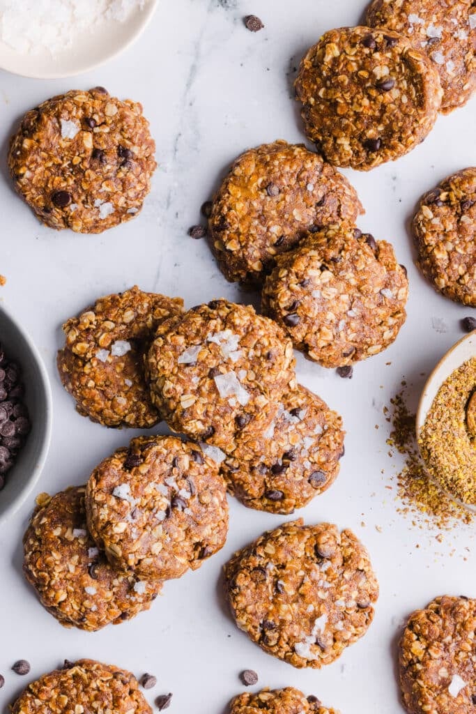 No bake protein cookies scattered on a countertop.