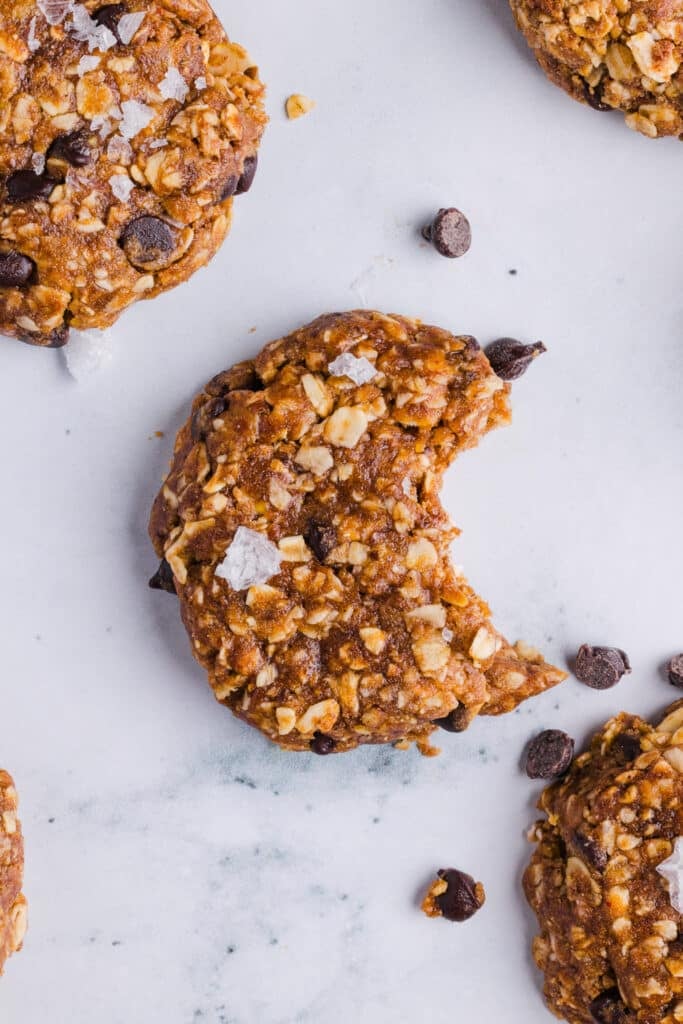 A no bake protein cookie with a bite taken out of it.