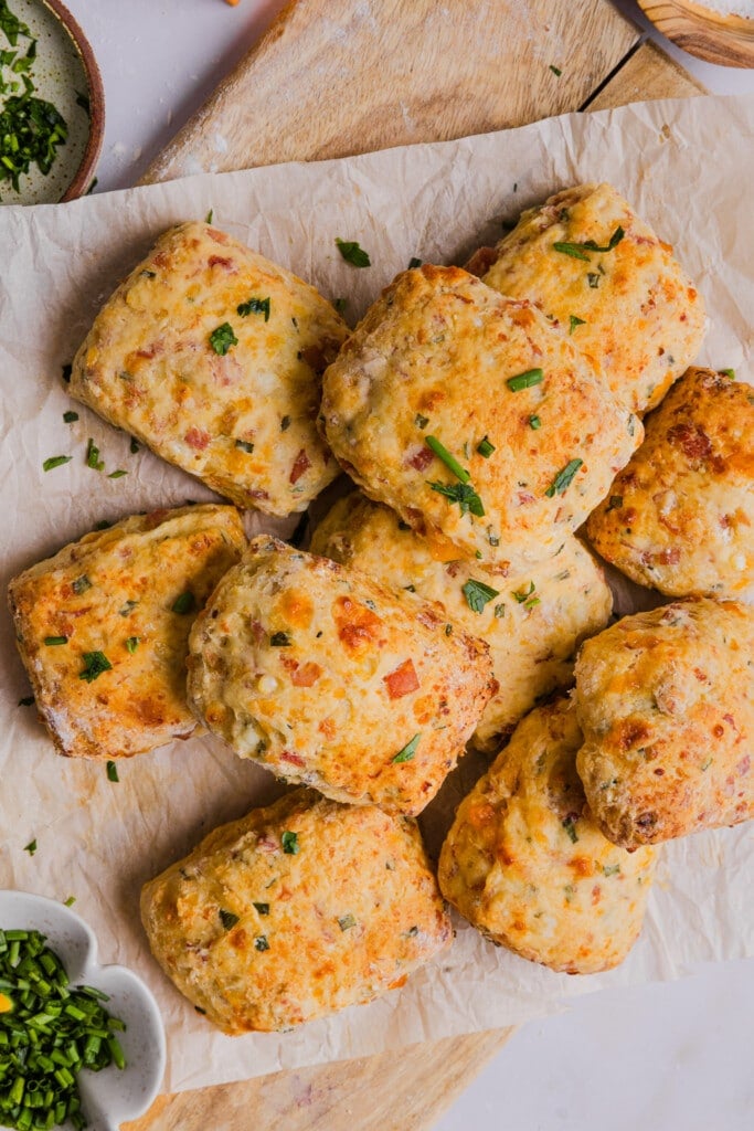 Protein biscuits on a wooden board with parchment paper.