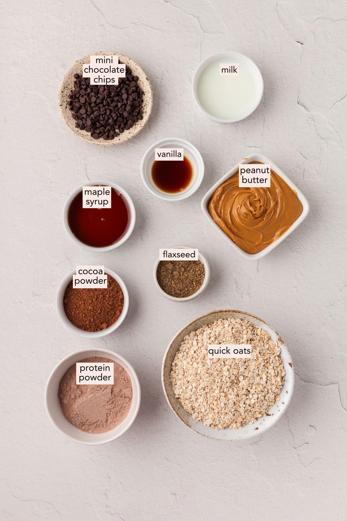 Ingredients for brownie protein bites on a countertop with labels.