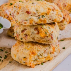 High protein biscuits stacked on a wooden board.