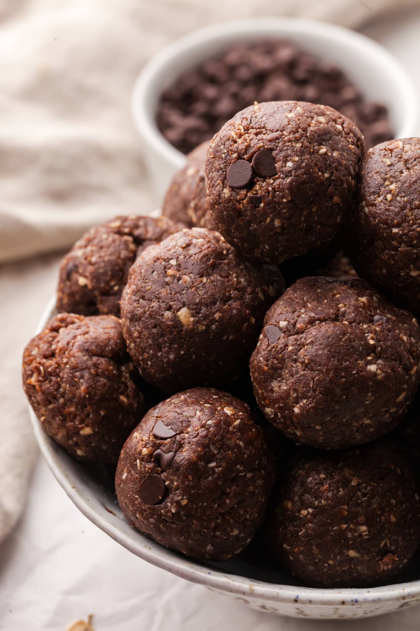 A pile of brownie protein bites on a plate.