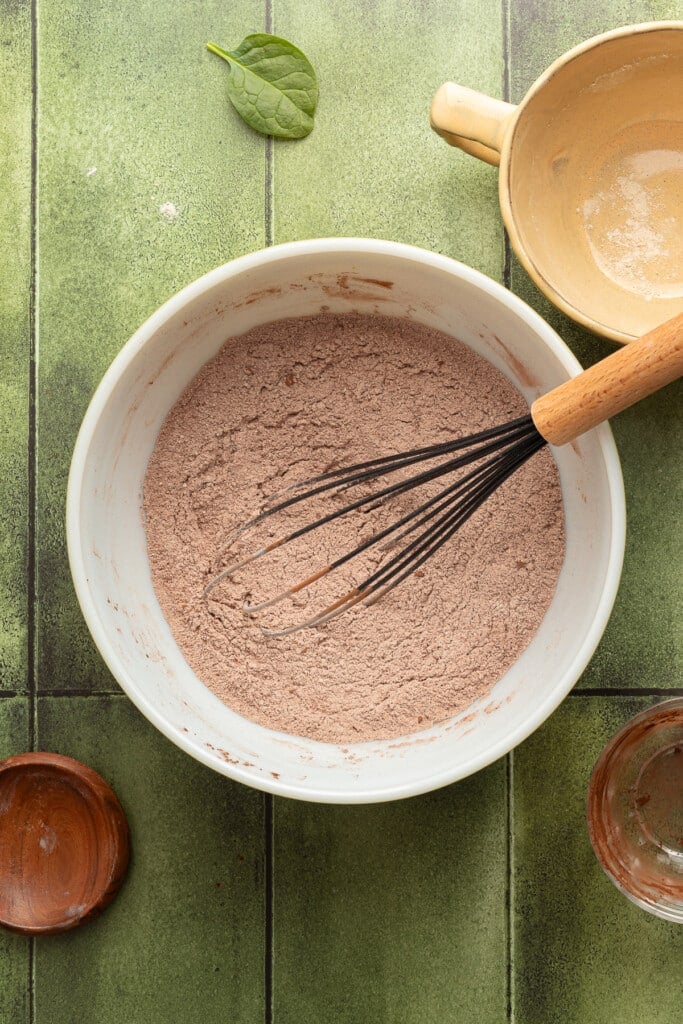 Dry ingredients mixed in a bowl for veggie chocolate muffins.