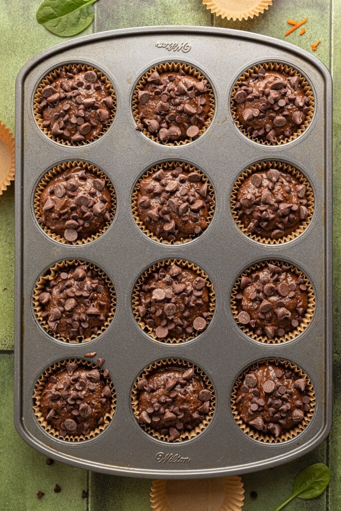 Chocolate veggie muffin batter topped with chocolate chips