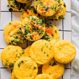 A platter with a mix of plain and veggie cottage cheese egg bites.