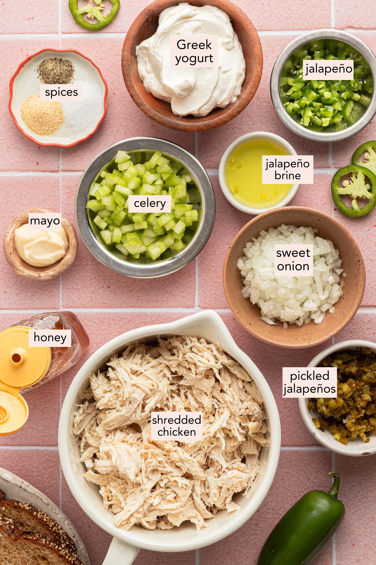 Ingredients for jalapeño chicken salad on a countertop with labels.