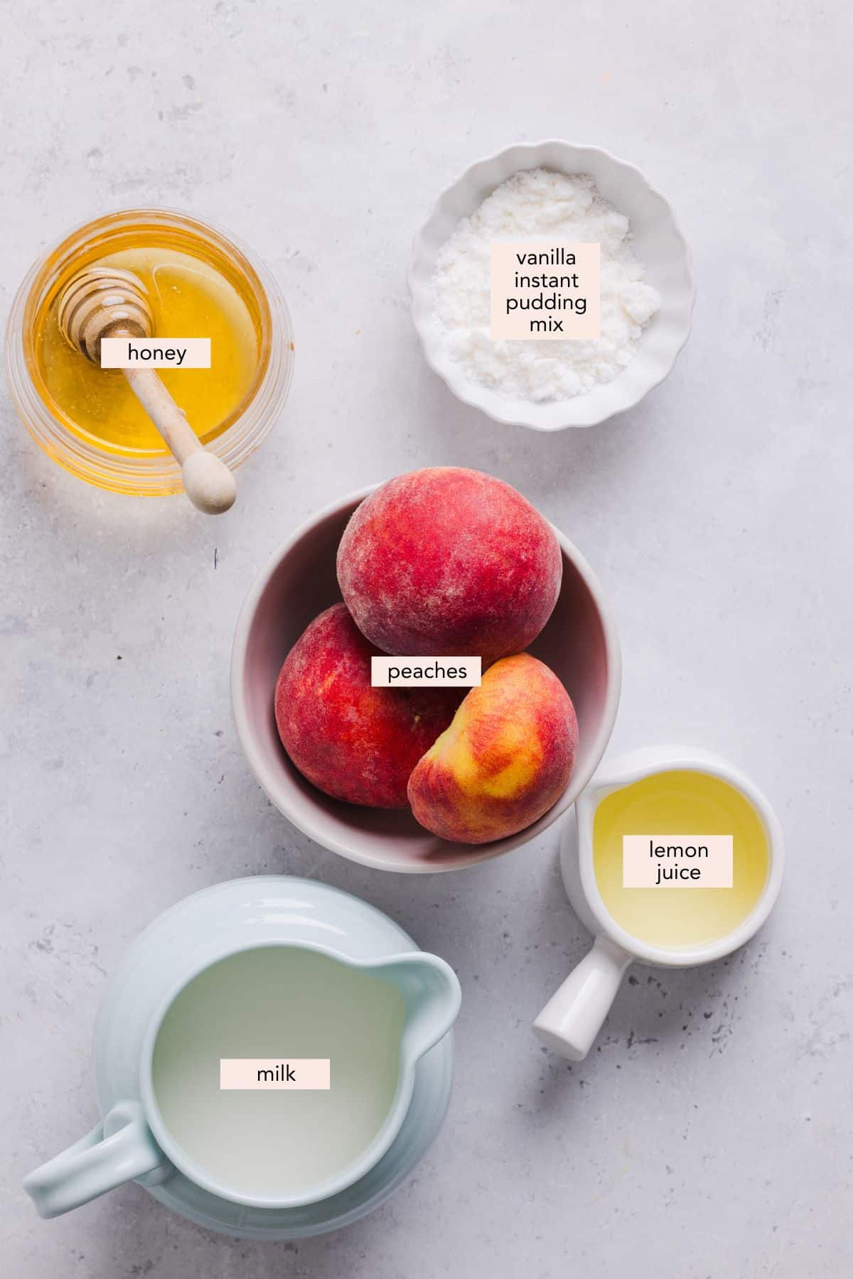Labeled ingredients for Ninja Creami peach ice cream.