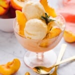 Ninja Creami peach ice cream served in a bowl with peach slices.