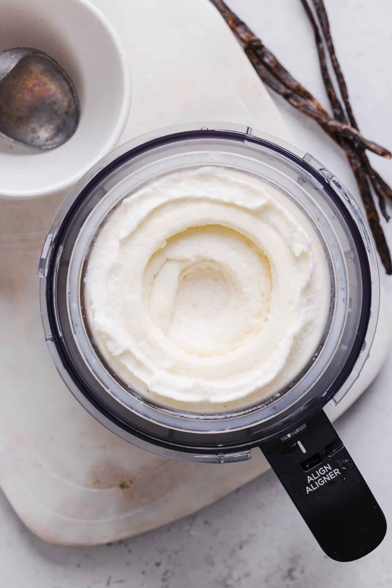 Vanilla ice cream in a Ninja Creami machine after running through light ice cream mode.
