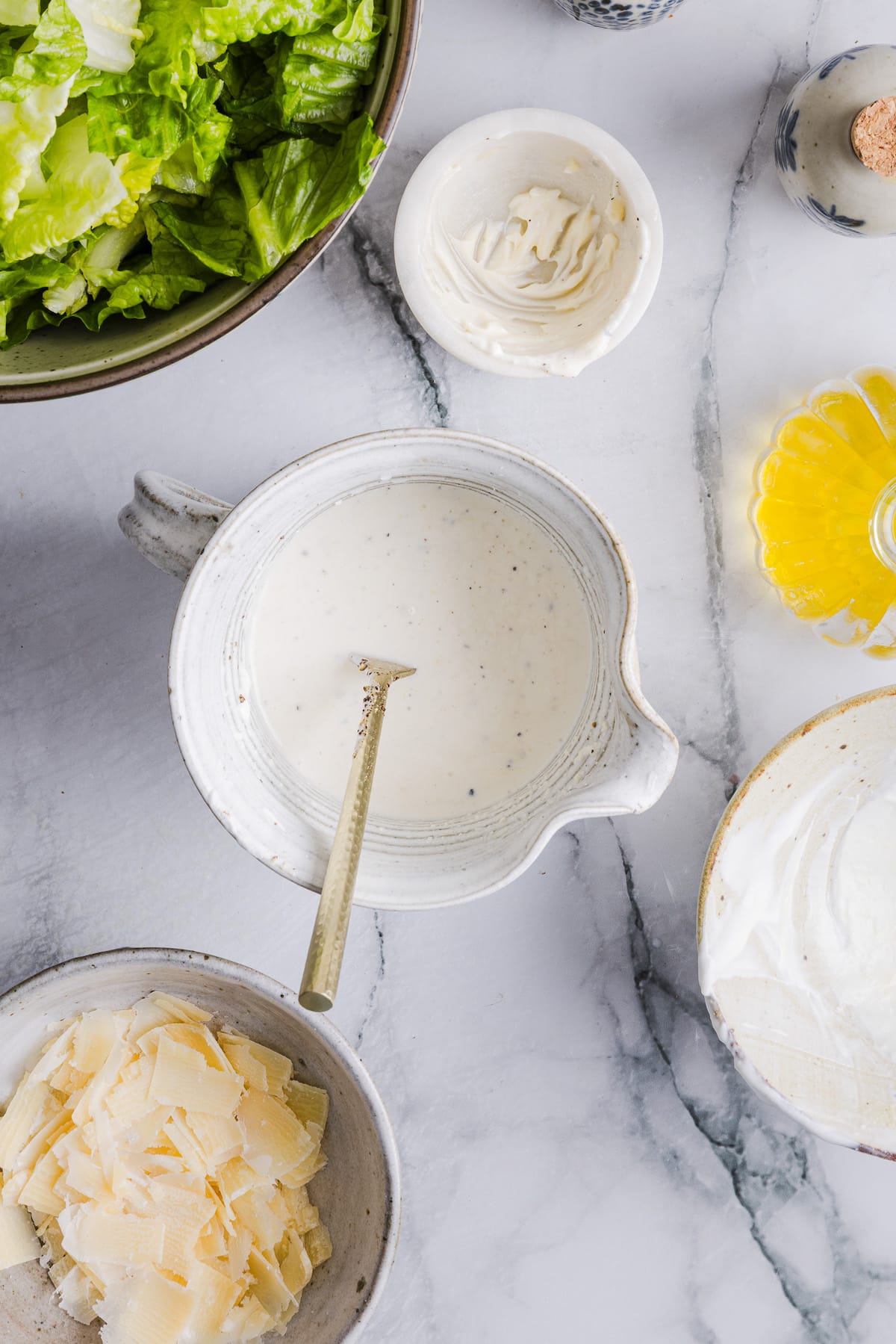 Greek yogurt caesar salad dressing mixed in a bowl.