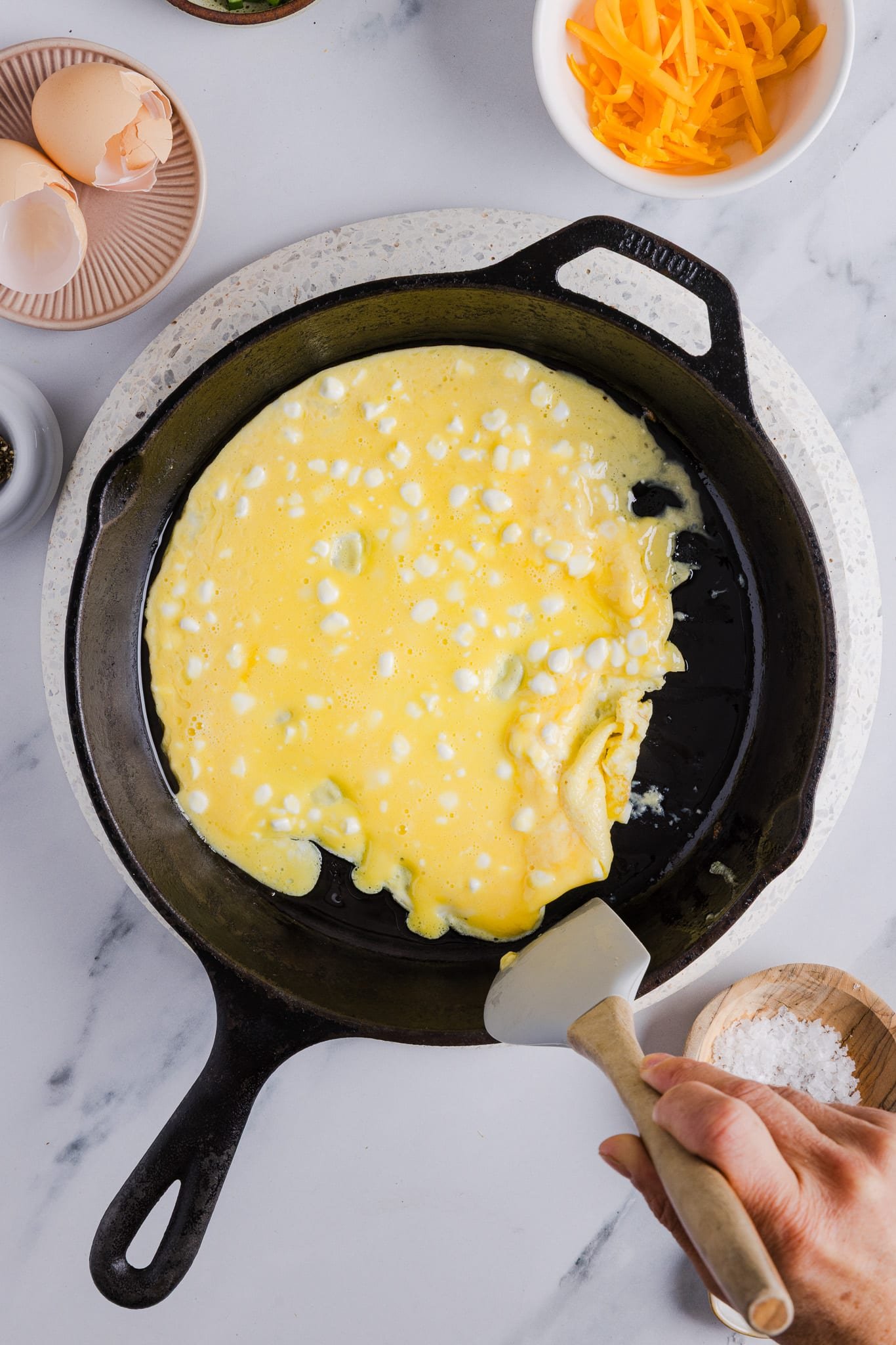 Cottage cheese eggs cooking in a pan.