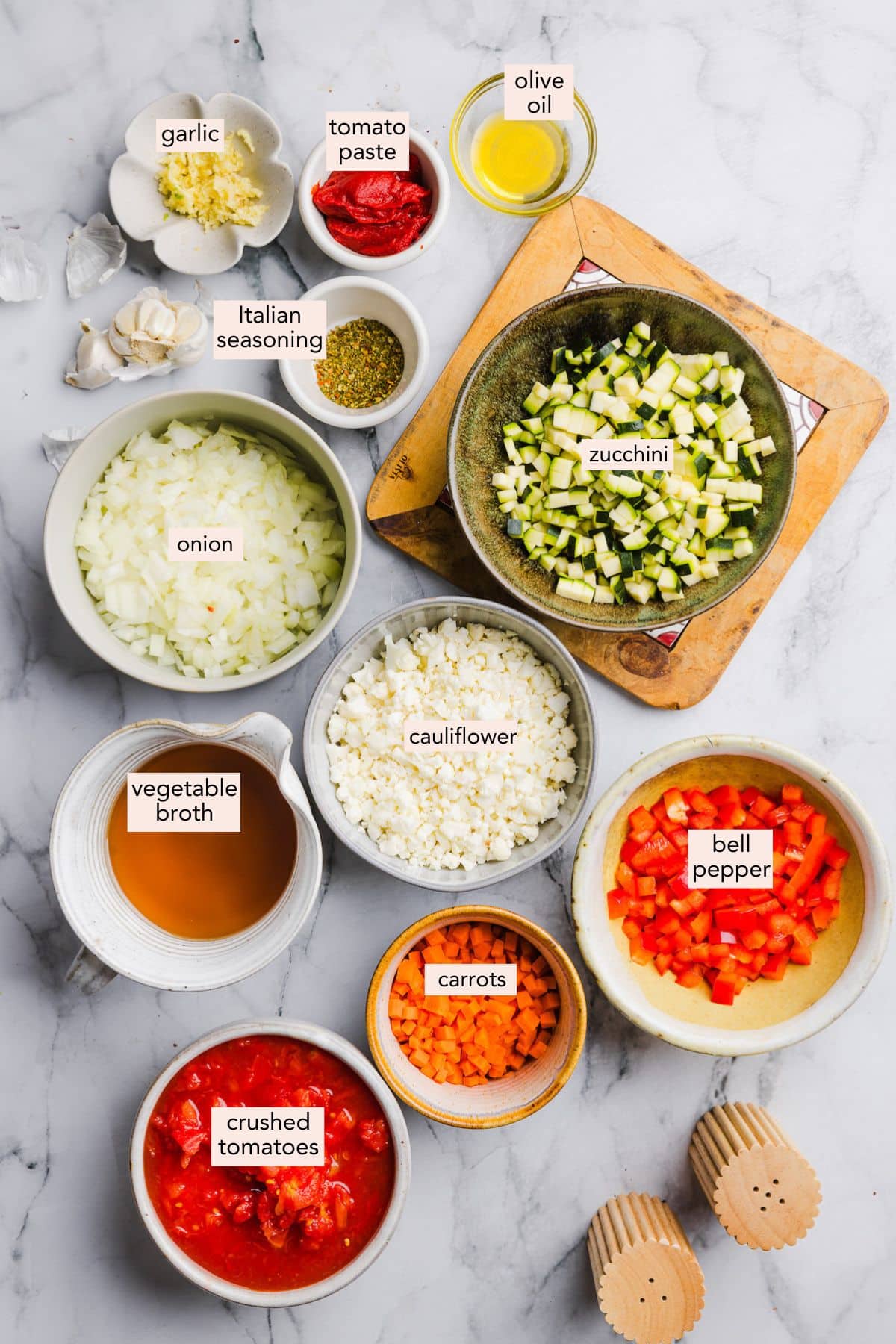 Hidden veggie pasta sauce ingredients on a countertop with labels.